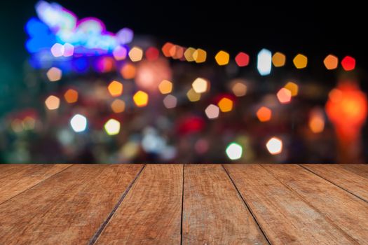 Perspective top wooden with abstract blurred lights in Loy Krathong festival