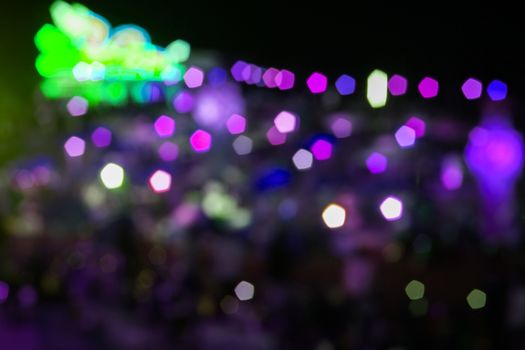 Abstract green and violet night lights with blurred background