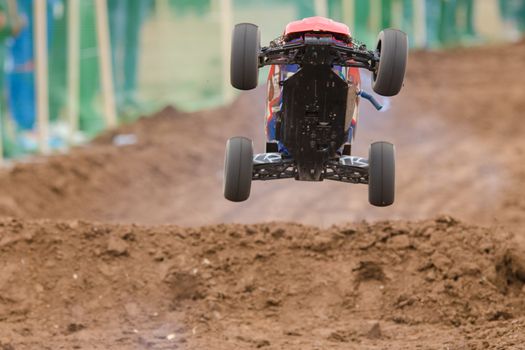 Volgograd, Russia - April 19, 2015: Radio-controlled machine with a combustion engine has jumped on the trampoline
