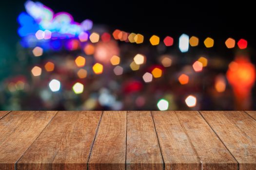 Brown wooden with abstract blurred night lights, stock photo