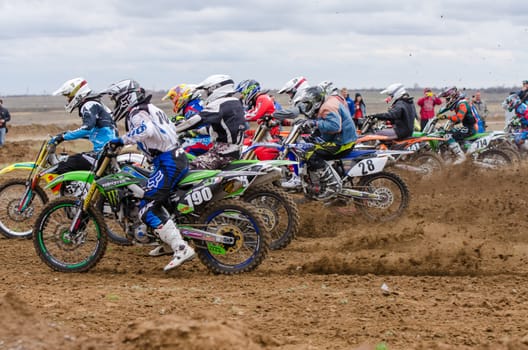 Volgograd, Russia - April 19, 2015: Motorcycle racer took the race start, at the stage of the Open Championship Motorcycle Cross Country Cup Volgograd Region Governor