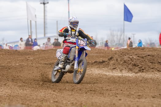 Volgograd, Russia - April 19, 2015: Motorcycle racer riding on dirt track, at the stage of the Open Championship Motorcycle Cross Country Cup Volgograd Region Governor