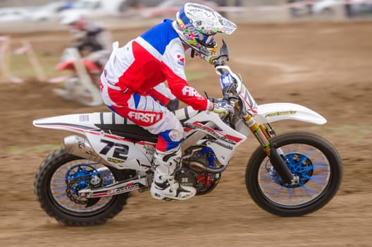 Volgograd, Russia - April 19, 2015: Motorcycle racer racing on dirt track, at the stage of the Open Championship Motorcycle Cross Country Cup Volgograd Region Governor