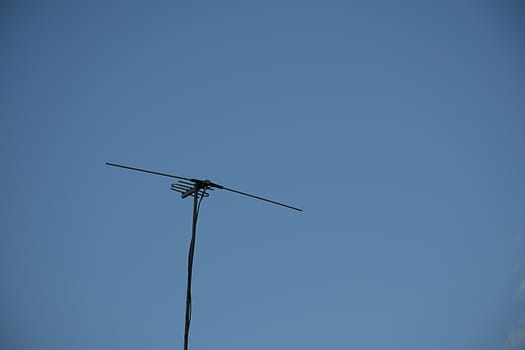 televisions antennas with clear sky background.