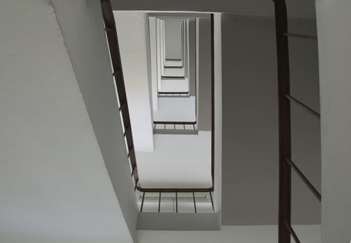 looking up stairwell building. Abstract architecture background.