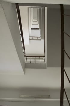 looking up stairwell building. Abstract architecture background.
