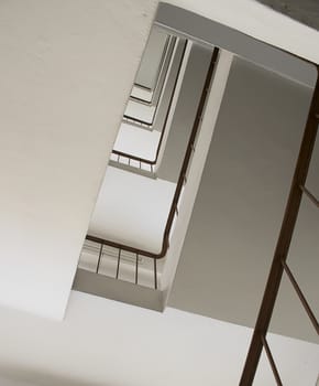 looking up stairwell building. Abstract architecture background.