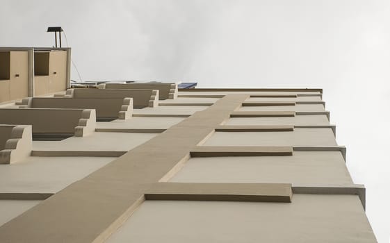 Look up at apartment housing in Thailand. Step of building.