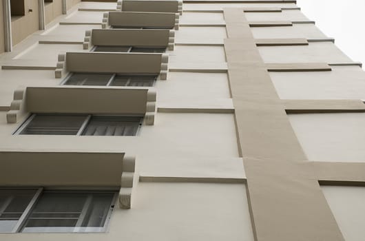 Look up at apartment housing in Thailand. Step of building.