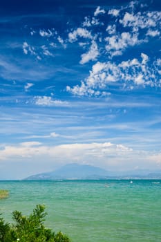 High mountains on other coast of Garda lake, Desenzano, italy