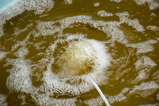 Air bubble on dirty water.