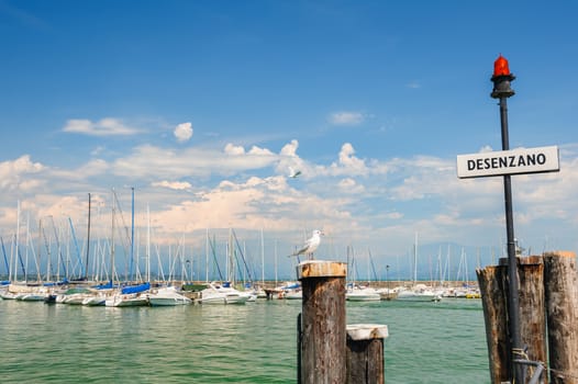 Desenzano, Lombardy, northern Italy, 15th August 2016: Small yachts in harbor in Desenzano del Garda, lake Garda, Italy