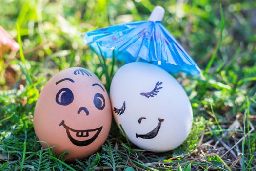 Funny eggs imitating couple of different races and surprised white person