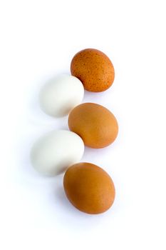 Composition of red and white eggs set in chain on white background