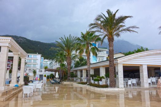 A rainy day  in summer vacation: beautiful garden and hotels in Kemer resort, Antalya.