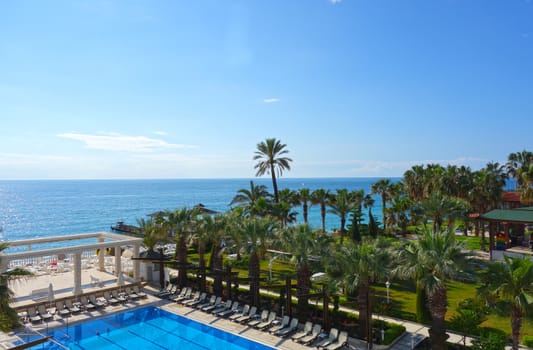 Beach hotel resort with swimming pool and garden in Antalya, Turkey
