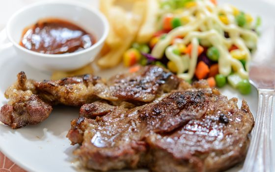 Beef steak on plate.Soft focus.