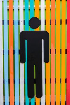 Men toilet signs on wooden plate colorful.