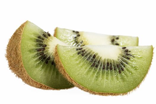 Pieces of green kiwi isolated on white background, close up
