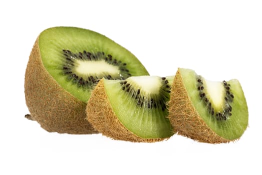 Pieces of green kiwi isolated on white background, close up