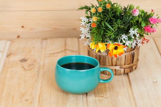 cup and vase on wood table