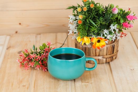 cup and vase on wood table