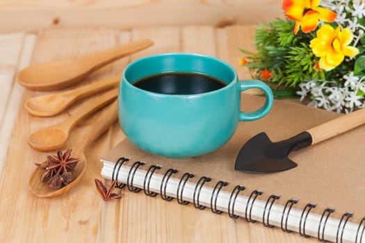 cup of coffee and book on  wood table