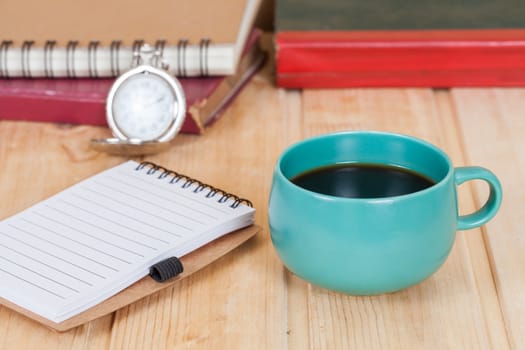 cup of coffee  on  wood table