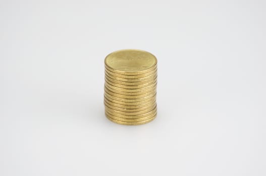 Close up pile of gold coins isolated place on white background.