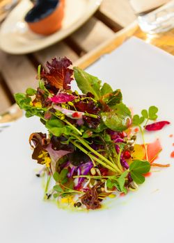 Healthy salad with flowers in a restaurant