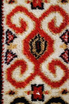 geometric  pattern old Persian carpet closeup