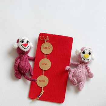 2016, year of monkey, handmade happy new year on white background, knitted monkey, funny stuffed animal, knit flower from yarn, red envelope for lucky money, sign for Vietnam Tet