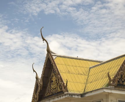 Serpent sculpture of temple roof in Thailand. ornament and detail in Thai art.