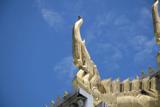 Serpent sculpture of temple roof in Thailand. ornament and detail in Thai art.