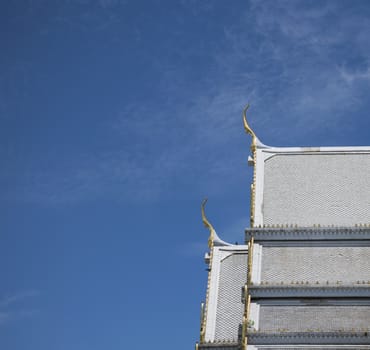 Serpent sculpture of temple roof in Thailand. ornament and detail in Thai art.