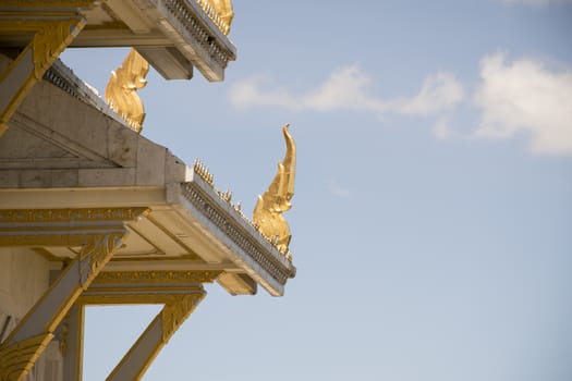 Serpent sculpture of temple roof in Thailand. ornament and detail in Thai art.