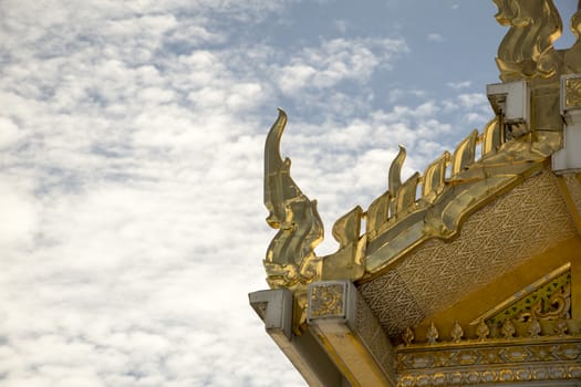 Serpent sculpture of temple roof in Thailand. ornament and detail in Thai art.