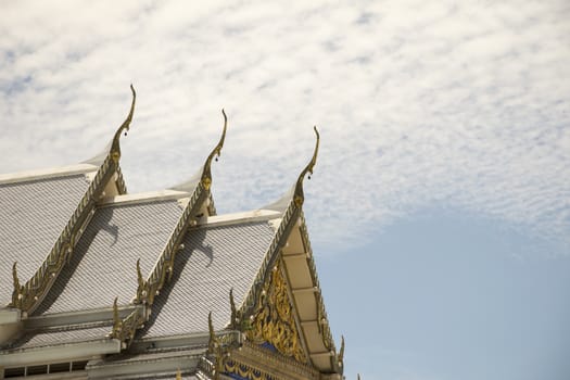 Serpent sculpture of temple roof in Thailand. ornament and detail in Thai art.