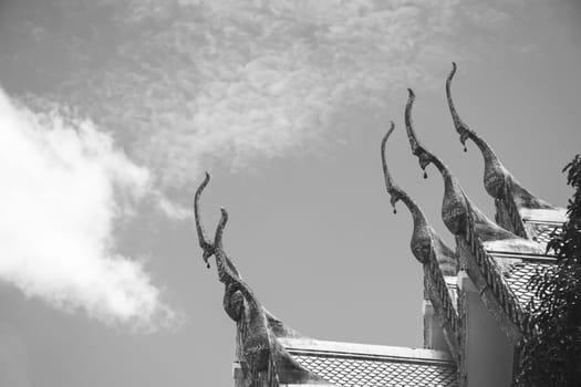 Serpent sculpture of temple roof in Thailand. ornament and detail in Thai art.