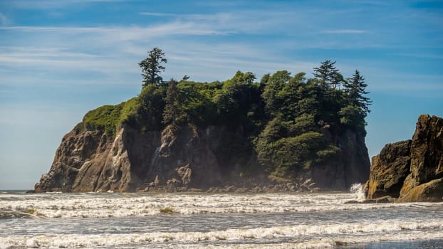 Waves crash on the shore around Abbey Island