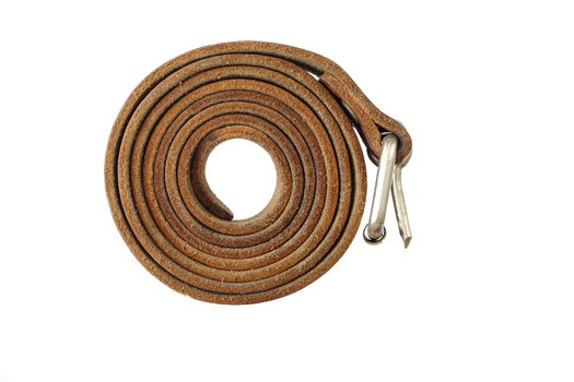 Coiled leather belt on a white background - tighten the belt