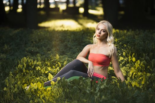 Concept: sport, healthy lifestyle. Young strong girl do exercises during street workout