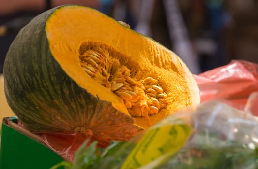 ripe pumpkin in a cut with seeds closeup