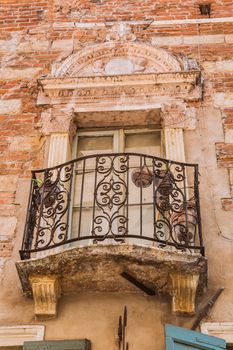exterior of an old building window and balcony