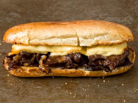 close up of rustic philly cheese steak sandwich