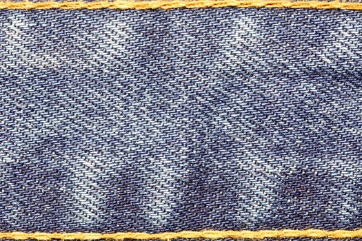 Denim jeans texture with strings and seams  for fashion background