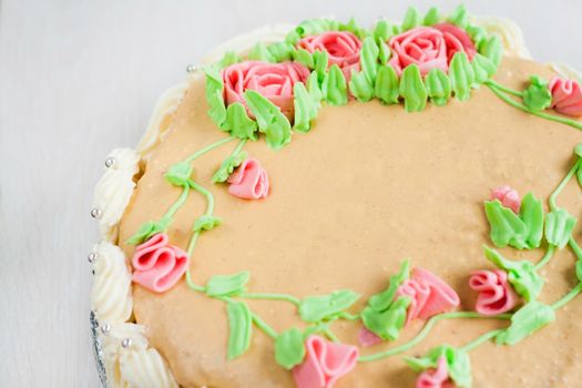 birthday cake decorated with roses, leaves, swirls and the inscription, Catherine Day