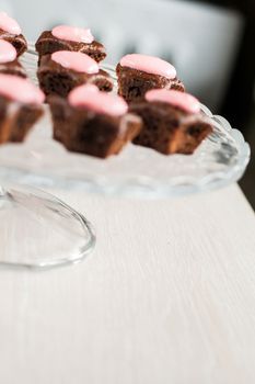 Chocolate cupcakes with pink stars-cream celebratory glass stand