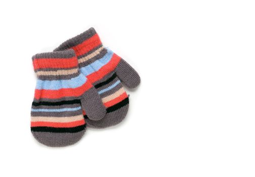 two knitted striped baby mittens isolated on white background
