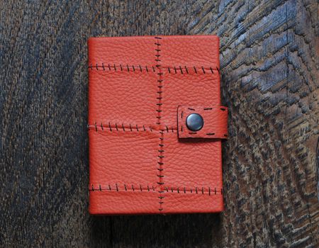  Red Notebook  on the  wooden background